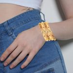 Golden Bangle Collection  Beautifully Carved Conch Shell Inspired Thick  Bangle Bracelets. Set of 4. in Gold Tone for Women - Image 2